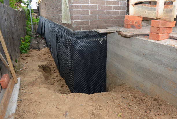 Happy homeowners after waterproofing job in Prior Lake